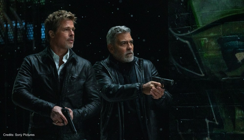 Brad pitt und George Clooney mit Pistolen in "Wolfs"